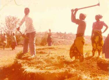 Villagers digging water pipes for the School